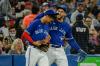 Christopher Katsarov - THE CANADIAN PRESS
Blue Jay George Springer, right, jokes with teammate Gosuke Katoh, who recorded his long-awaited first career major-league hit in the fourth inning on Wednesday night.