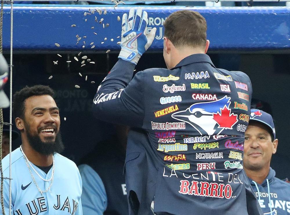 Steve Russell - Toronto Star
Blue Jay Matt Chapman gets the home run jacket and the sunflower seed treatment — courtesy of Teoscar Hernández, with manager Charlie Montoyo looking on — after his second-inning blast in Monday night’s win over the Mariners at the Rogers Centre.