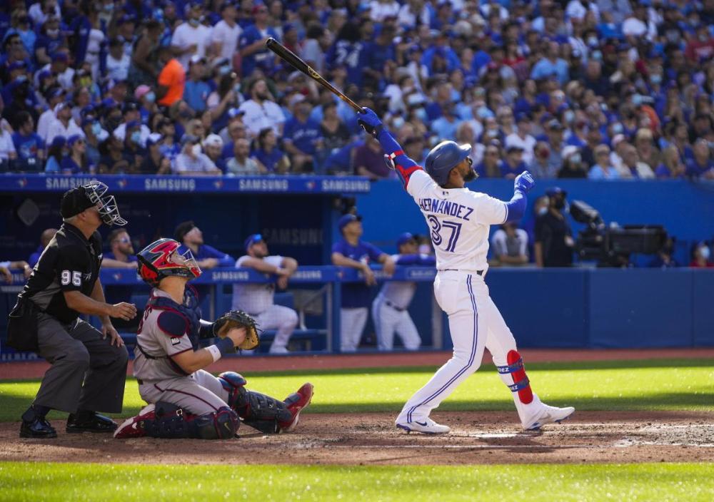 Mark Blinch - GETTY IMAGES
Teoscar Hernández watches a three-run homer that just cleared the left-field fence in the fourth inning.