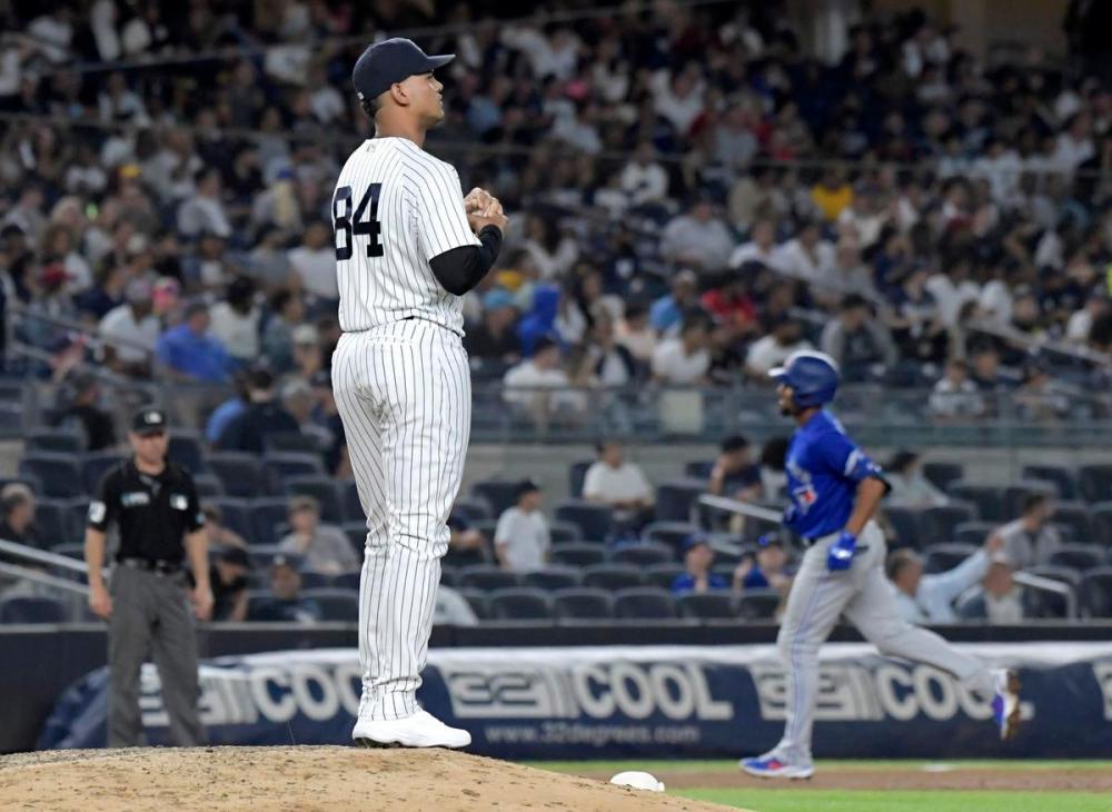 Bill Kostroun - The Associated Press
Yankees relief pitcher Albert Abreu waits as the Blue Jays' Marcus Semien runs the bases on a home run in the fifth inning Tuesday, the second baseman’s third straight game with a homer.