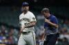 John Fisher - GETTY IMAGES
John Axford of the Milwaukee Brewers leaves the game in the ninth inning with an injury against the Pittsburgh Pirates on Monday.