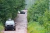 Police officers search a back road on Saturday, July 11, 2020 in Saint-Apollinaire, Que. Quebec provincial police say the father of two young girls found dead over the weekend in a rural area southwest of Quebec City may be desperate and looking for materials to ensure his survival.THE CANADIAN PRESS/Jacques Boissinot