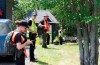 Police officers and volunteers stand in line before entering the woods to search, Friday, July 10, 2020 in Saint-Apollinaire Que. Police are continuing their search around a Quebec City suburb after they issued an Amber Alert Thursday for two young girls and their 44-year-old father who investigators believe disappeared following a highway car crash.THE CANADIAN PRESS/Jacques Boissinot