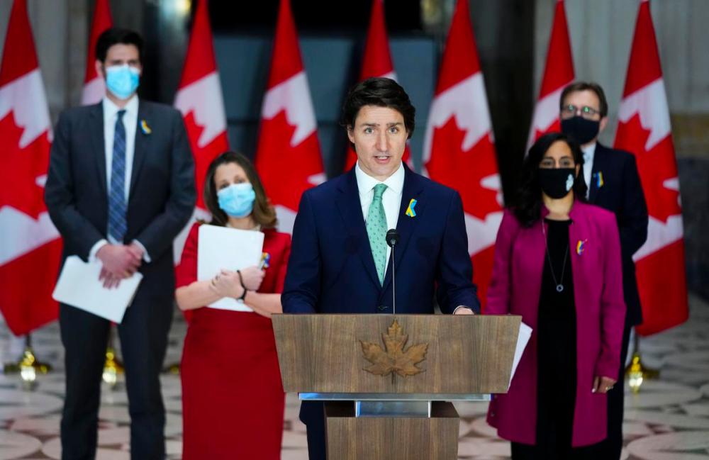 Sean Kilpatrick - THE CANADIAN PRESS
Prime Minister Justin Trudeau speaks as he is joined by Minister of Immigration, Refugees and Citizenship, Sean Fraser, left to right, Deputy Prime Minister and Minister of Finance Chrystia Freeland, Minister of National Defence Anita Anand, and Minister of Natural Resources Jonathan Wilkinson during a news conference in Ottawa on Monday, Feb. 28, 2022, in response to the Ukraine crisis.