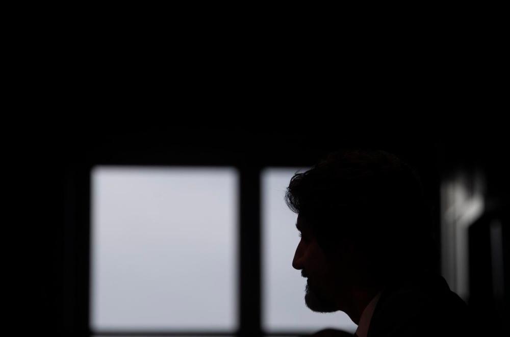 Adrian Wyld - THE CANADIAN PRESS
Prime Minister Justin Trudeau is silhouetted against a window as he listens to a question during a year-end interview with The Canadian Press in Ottawa on Dec. 16, 2020.