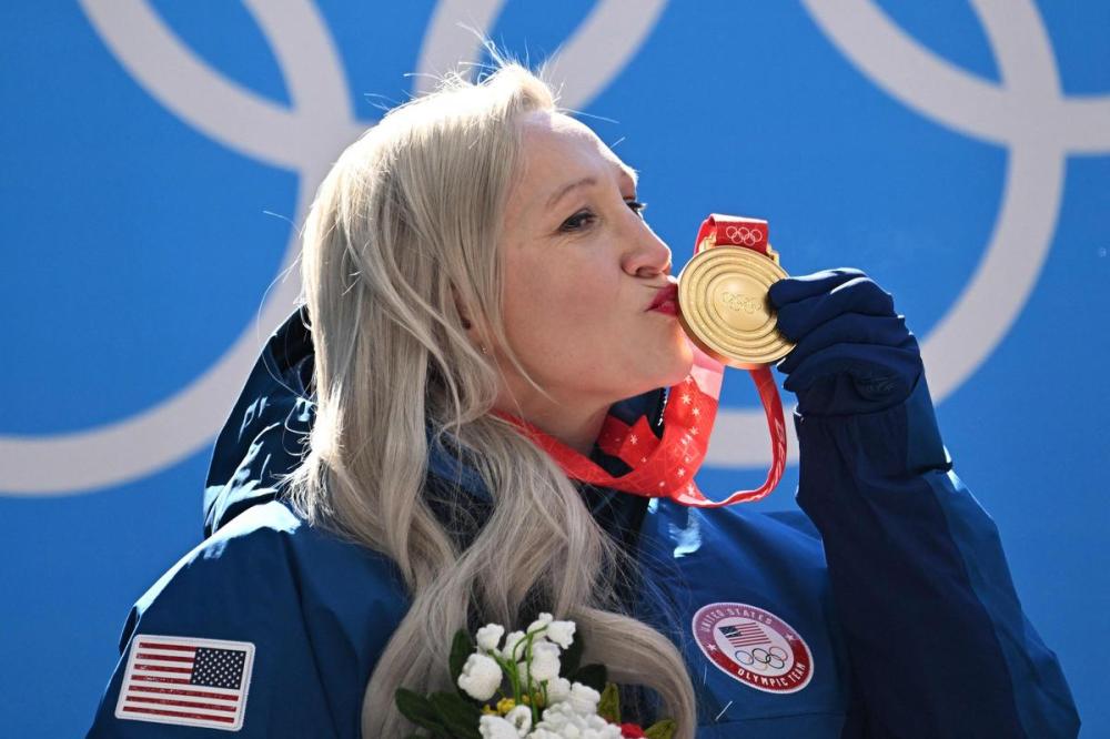 FRANCOIS-XAVIER MARIT - AFP via GETTY IMAGES
Kaillie Humphries of the U.S. celebrates with the gold medal after the women's monobob bobsleigh event at the Yanqing National Sliding Centre during the Beijing 2022 Winter Olympic Games on Monday.
