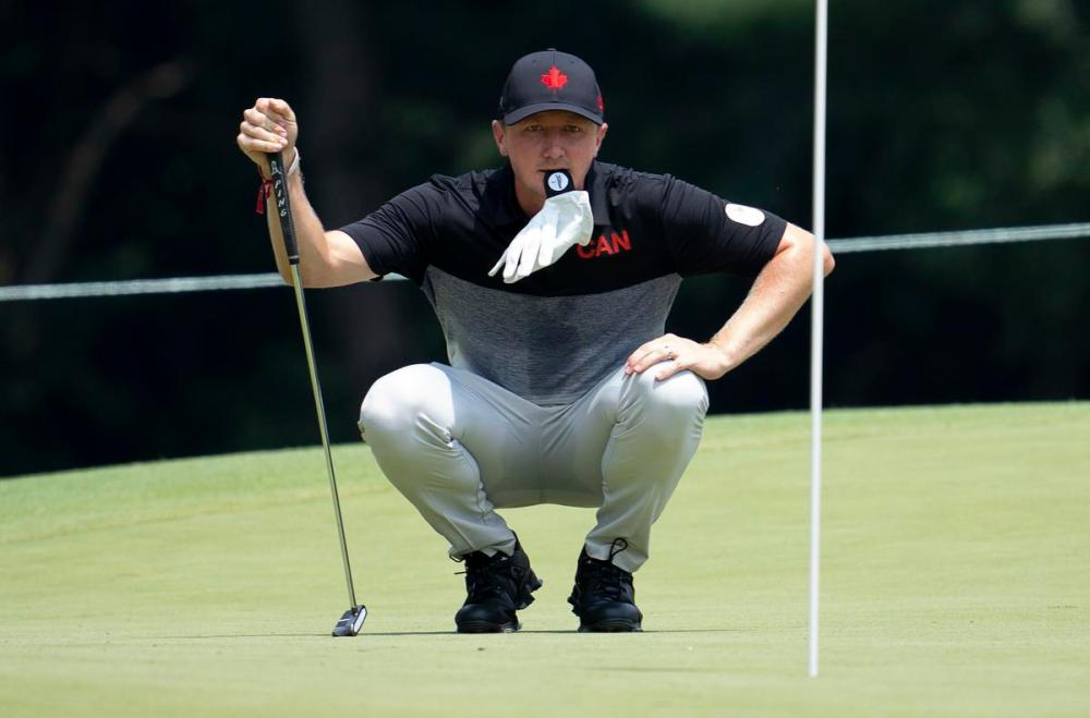 Adrian Wyld - THE CANADIAN PRESS
Canadian golfer Mackenzie Hughes, from Dundas, Ont. lines up a putt on the 11th hole during the first day of competition at the Kasumigaseki Country Club at the Tokyo Summer Olympic Games on Thursday.