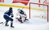 CP
Nikolaj Ehlers scores the game-winning overtime goal on Elvis Merzlikins Friday. (John Woods / The Canadian Press)