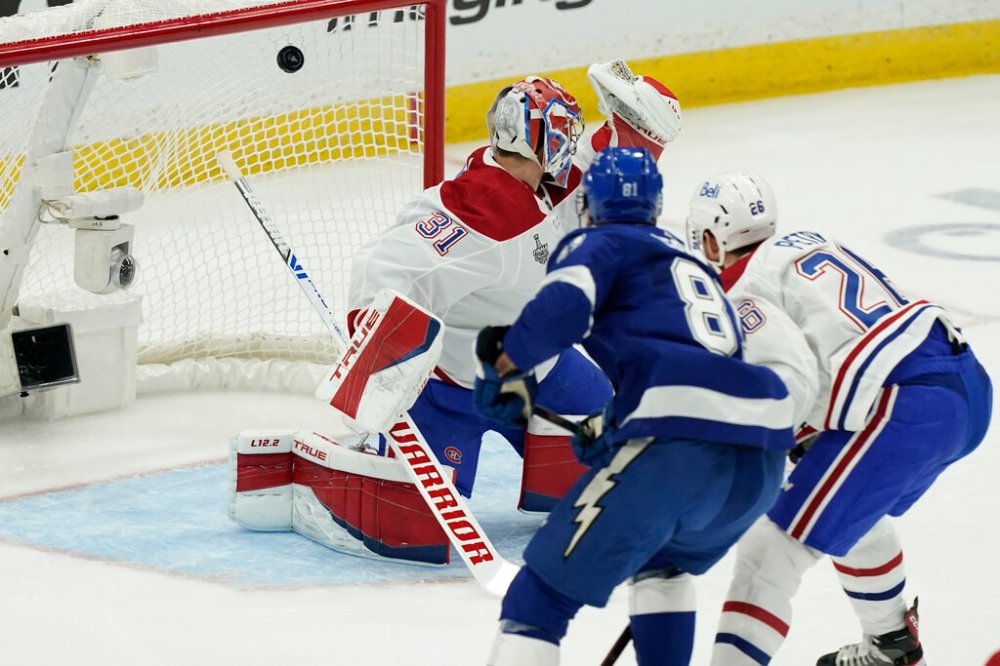 CP
Erik Cernak scores on Carey Price during the first period Monday. (Gerry Broome / The Associated Press)