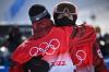 MARCO BERTORELLO - AFP via GETTY IMAGES
Slopestyle gold medallist Max Parrot, left, hugs fellow Canadian and bronze medallist Mark McMorris after their controversial competition.