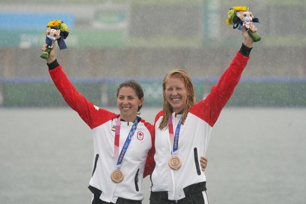Nathan Denette - THE CANADIAN PRESS
The rain falls as Laurence Vincent Lapointe, right, and Katie Vincent celebrate after winning a bronze medal in the women’s canoe double 500-metre finals during the Tokyo Olympics on Saturday.