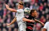 Bayern's Joshua Kimmich, left, and Duesseldorf's Rouwen Hennings challenge for the ball during the German Bundesliga soccer match between Fortuna Duesseldorf and FC Bayern Munich in Duesseldorf, Germany, Saturday, Nov. 23, 2019. (AP Photo/Martin Meissner)