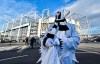 A Borussia fan dressed as ghost stands in front of the stadium prior the German Bundesliga soccer match between Borussia Moenchengladbach and 1.FC Cologne in Moenchengladbach, Germany, Wednesday, March 11, 2020. It is the first Bundesliga match played behind closed doors without spectators due to the coronavirus outbreak. For most people, the new coronavirus causes only mild or moderate symptoms, such as fever and cough. For some, especially older adults and people with existing health problems, it can cause more severe illness, including pneumonia. (AP Photo/Martin Meissner)