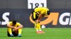 Dortmund's Emre Can, right, and Dortmund's Manuel Akanji, left, react disappointed after losing the German Bundesliga soccer match between Borussia Dortmund and Eintracht Frankfurt in Dortmund, Germany, Saturday, April 3, 2021. (AP Photo/Martin Meissner, Pool)