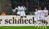 Moenchengladbach's scorer Marcus Thuram, center, celebrates his goal jumping with teammate Breel Embolo, left, during the German Bundesliga soccer match between Borussia Moenchengladbach and Borussia Dortmund in Moenchengladbach, Germany, Friday, Jan. 22, 2021. Moenchengladbach defeated Dortmund with 4-2. (AP Photo/Martin Meissner, Pool)