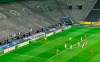 Players run for the ball in an empty stadium during the German Bundesliga soccer match between Borussia Moenchengladbach and 1.FC Cologne in Moenchengladbach, Germany, Wednesday, March 11, 2020. It is the first Bundesliga match played behind closed doors without spectators due to the coronavirus outbreak. For most people, the new coronavirus causes only mild or moderate symptoms, such as fever and cough. For some, especially older adults and people with existing health problems, it can cause more severe illness, including pneumonia. (AP Photo/Martin Meissner)