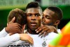 Moenchengladbach's Breel Embolo, center, is celebrated after he scored the opening goal during the German Bundesliga soccer match between Borussia Moenchengladbach and 1.FC Cologne in Moenchengladbach, Germany, Wednesday, March 11, 2020. It is the first Bundesliga match played behind closed doors without spectators due to the coronavirus outbreak. (AP Photo/Martin Meissner)