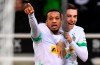 Moenchengladbach's scorer Alassane Plea, left, celebrates his goal with teammate Florian Neuhaus, right, during the German Bundesliga soccer match between Borussia Moenchengladbach and SC Paderborn in Moenchengladbach, Germany, Wednesday, Dec. 18, 2019. (AP Photo/Martin Meissner)