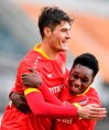 Leverkusen's scorer Patrik Schick, left, celebrates with Leverkusen's Jeremie Frimpong after scoring the opening goal during the German Bundesliga soccer match between Borussia Moenchengladbach and Bayer Leverkusen in Moenchengladbach, Germany, Saturday, March 6, 2021. (AP Photo/Martin Meissner, Pool)