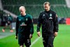 Bremen's Davy Klaassen, left, and Bremen's head coach Florian Kohfeldt leave the pitch after the German Bundesliga relegation first leg soccer match between Werder Bremen and 1. FC Heidenheim in Bremen, Germany, Thursday, July 2, 2020. Because of the coronavirus outbreak all soccer matches of the German Bundesliga take place without spectators. (AP Photo/Martin Meissner, Pool)
