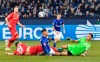 Union's Florian Hubner, Schalke's Amine Harit and Union's goalkeeper Rafal Gikiewicz, from left, challenge for the ball during the German Bundesliga soccer match between FC Schalke 04 and Union Berlin in Gelsenkirchen, Germany, Friday, Nov. 29, 2019. (AP Photo/Martin Meissner)