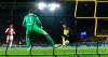 Dortmund's Jadon Sancho, right, scores the opening goal against Slavia's goalkeeper Ondrej Kolar during the Champions League Group F soccer match between Borussia Dortmund and Slavia Praha in Dortmund, Germany, Tuesday, Dec. 10, 2019. (AP Photo/Martin Meissner)