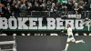 Moenchengladbach's Alassane Plea celebrates in front of supporters after he scored his second goal during the German Bundesliga soccer match between Borussia Moenchengladbach and FSV Mainz 05 in Moenchengladbach, Germany, Saturday, Jan. 25, 2020. (AP Photo/Martin Meissner)