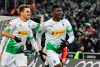 Moenchengladbach's Breel Embolo, right, celebrates his second goal with Patrick Herrmann during the German Bundesliga soccer match between Borussia Moenchengladbach and SC Freiburg in Moenchengladbach, Germany, Sunday, Dec. 1, 2019. (AP Photo/Martin Meissner)