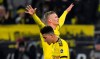 Dortmund's Erling Haaland, up, celebrates after scoring his side's 4th goal behind Dortmund's third scorer Jadon Sancho, during the German Bundesliga soccer match between Borussia Dortmund and 1. FC Cologne in Dortmund, Germany, Friday, Jan. 24, 2020. (AP Photo/Martin Meissner)