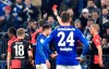 Berlin's Jordan Torunarigha, left, gets the red card during the German soccer cup, DFB Pokal, match between FC Schalke 04 and Hertha BSC Berlin in Gelsenkirchen, Germany, Tuesday, Feb. 4, 2020. (AP Photo/Martin Meissner)