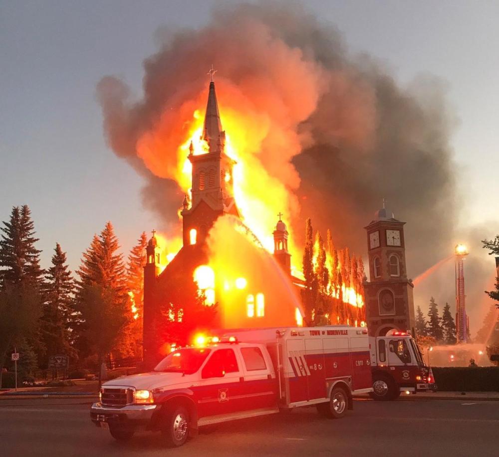 Tracy Dalzell-Heise - The Canadian Press
A fire burns a Catholic Church as shown in this handout image provided by Tracy Dalzell-Heise in Morinville, Alta., on Wednesday.