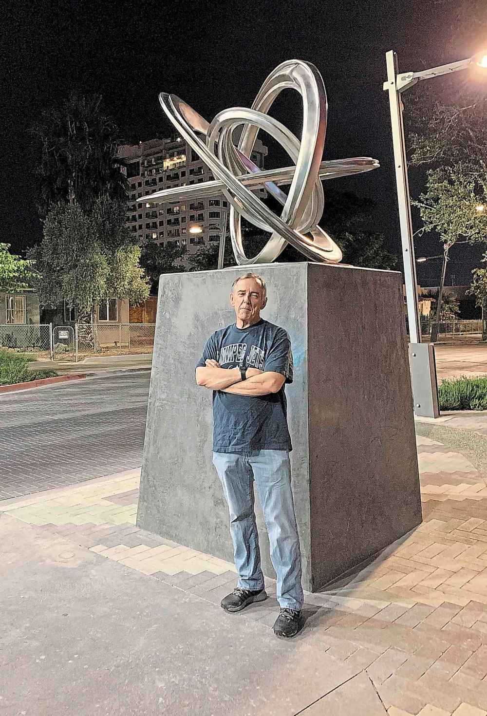 Sculptor Wayne Littlejohn with his latest work, Atomic Tumbleweed. (Supplied)