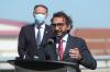 David Kawai - THE CANADIAN PRESS
Federal Transport Minister Omar Alghabra speaks while Ottawa South MP David McGuinty looks on during a press conference at the Ottawa MacDonald-Cartier International Airport on June 16, 2021.