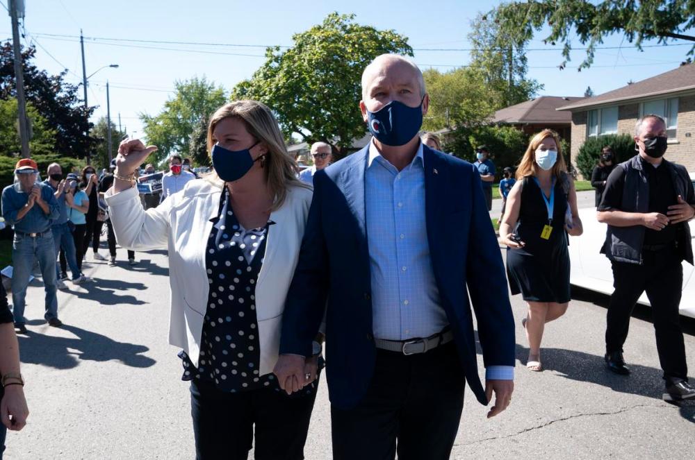 Adrian Wyld - THE CANADIAN PRESS
Conservative Leader Erin O'Toole and his wife, Rebecca, spent the day before the election campaigning in four Liberal-held ridings in Ontario — Oakville, Markham Thornhill, York Centre, and Don Valley West.
