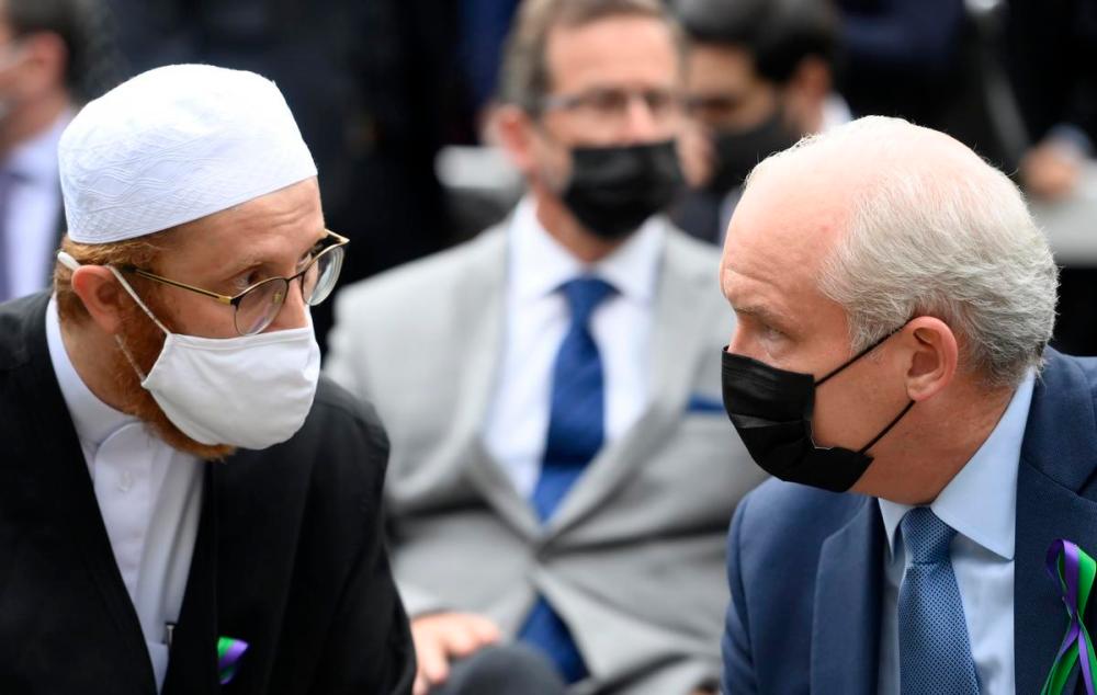 Nathan Denette - THE CANADIAN PRESS FILE PHOTO
Conservative Leader Erin O'Toole, right, speaks with London Muslim Mosque imam Abd Alfatah Twakkal at a vigil for the victims of the deadly vehicle attack on five members of the Canadian Muslim community in London, Ont., on June 8, 2021.