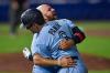 Adrian Kraus - The Associated Press
Joe Panik is embraced by Rowdy Tellez after his ninth-inning sacrifice fly brought home Vladimir Guerrero with the winning run.
