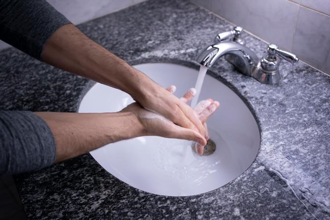 A man washes his hands in Montreal on Tuesday, March 3, 2020. It took the arrival of a frightening new coronavirus to put fresh scrutiny on a healthy habit that global health officials say is one of the best ways to prevent infection: handwashing. But are we really that bad at something all of us ostensibly do multiple times a day? Yes, and specatularly so, according to an infection control epidemiologist at the University of Toronto. THE CANADIAN PRESS/Paul Chiasson