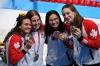 JONATHAN NACKSTRAND - AFP via GETTY IMAGES
Canada’s Kylie Masse, left to right, Sydney Pickrem, Margaret Mac Neil and Penny Oleksiak pose with their bronze medals after the women’s 4x100m medley relay Sunday.