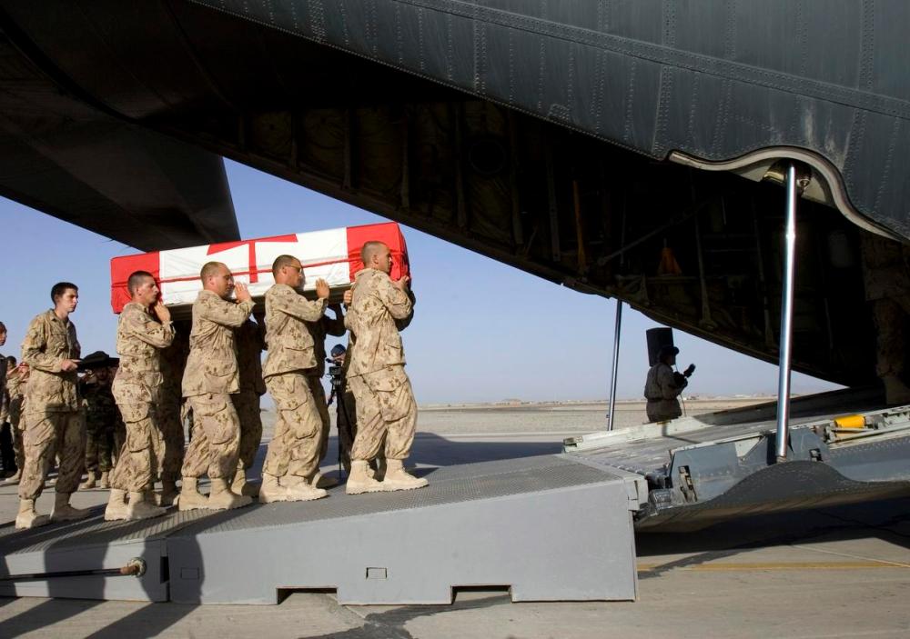 Ryan Remiorz - The Canadian Press File Photo
Soldiers carry the casket of Trooper Patrick James Pentland during ramp ceremonies for him and Master Cpl. Allan Stewart at the base in Kandahar, Afghanistan in 2007.