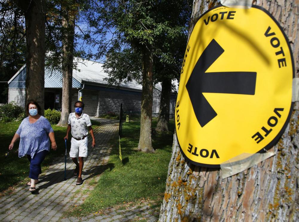 CLIFFORD SKARSTEDT - EXAMINER
People exit a polling station after casting their ballots in the riding of Peterborough-Kawartha on Monday Sept. 20, 2021