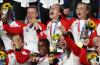 Naomi Baker - Getty Images file photo
Coach Bev Priestman, top left, and the Canadian women’s soccer team had a lot to celebrate in Tokyo. The Olympic gold medal was the country’s first in the sport.