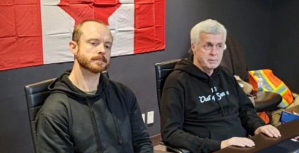 Tom Quiggin, right, and Daniel Bulford talk to supporters of the Ottawa occupation during a news conference Thursday.