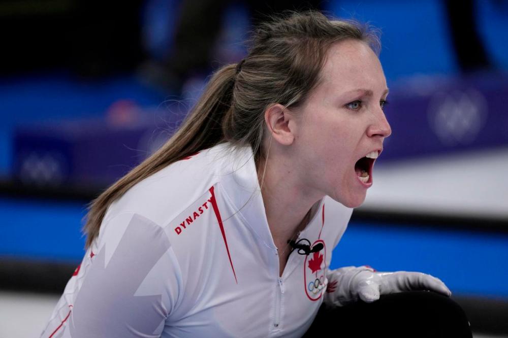 Nariman El-Mofty - AP FILE PHOTO
Canada's Rachel Homan, directs her team mate John Morris, as he sweeps the ice during the mixed doubles match on Feb. 5 at the 2022 Winter Olympics.