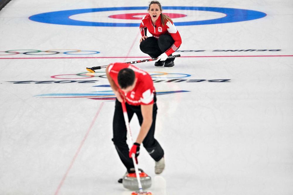 LILLIAN SUWANRUMPHA - AFP via GETTY IMAGES
Canada's Rachel Homan and John Morris finished with a 5-4 record in the Olympics mixed doubles tournament and failed to advance to the semifinals.