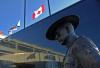 TIM KROCHAK - AFP via GETTY IMAGES
Flags of Nova Scotia and Canada fly at half-staff outside the Nova Scotia Royal Canadian Mounted Police (RCMP) headquarters in Dartmouth, N.S. on April 19, 2020.