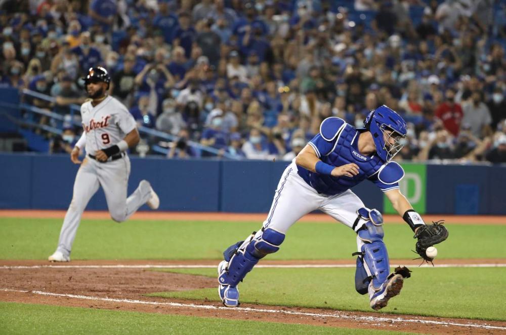 Richard Lautens - Toronto Star
The Tigers’ Willi Castro scores the winning run in the 10th inning as Blue Jays catcher Reese McGuire heads up the first-base line to track down the throw from left-fielder Lourdes Gurriel Jr.