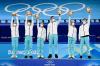 WANG ZHAO - AFP via GETTY IMAGES
Russia's Kamila Valieva, Mark Kondratiuk, Anastasia Mishina, Aleksandr Galliamov, Victoria Sinitsina and Nikita Katsalapov celebrate during the flower ceremony of the figure skating team event.