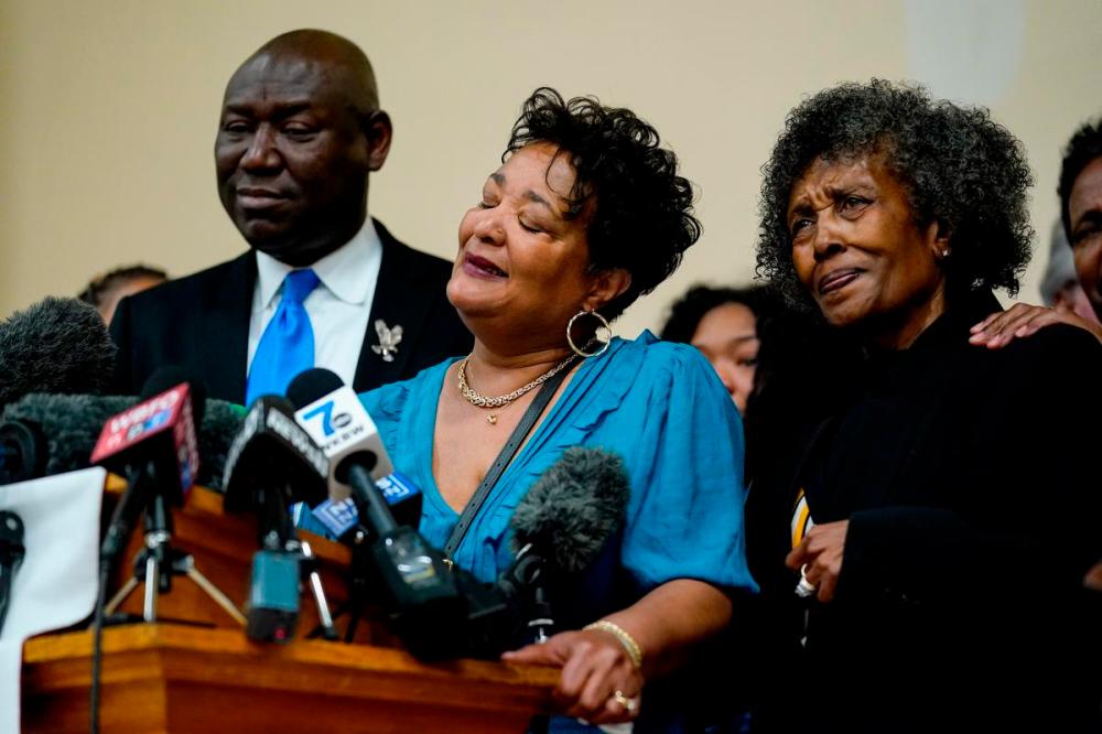 Matt Rourke - AP
The daughters of Ruth Whitfield, a victim of a mass shooting, Angela Crawley, center, and Robin Harris, accompanied by attorney Benjamin Crump, speak during a news conference in Buffalo, N.Y., Monday, May 16, 2022.