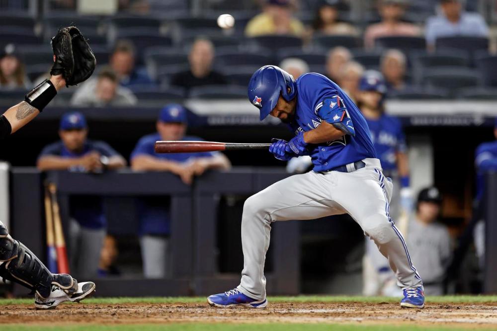 Adam Hunger - The Associated Press
The Jays' Marcus Semien ducks out of the way of a high pitch from New York’s Luis Gil during the third inning Wednesday. Toronto has won three straight games in the Bronx.