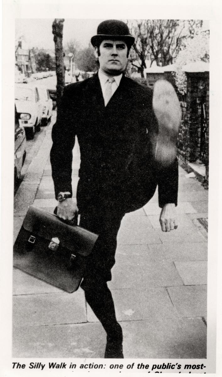 John Cleese in “The Ministry of Silly Walks” sketch.